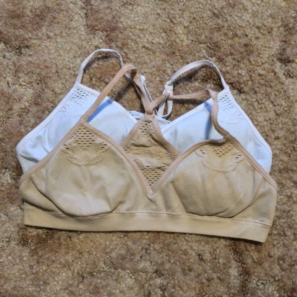 Pair of padded bralettes, nude and white.
